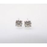 A pair of Diamond Ear Studs each claw-set brilliant-cut stone in 18ct white gold, total diamond