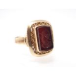 An Intaglio Ring the black onyx carved Mercury in pierced mount, stamped 750, ring size T 1/2,