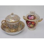 A Spode lidded Chocolate Cup and Cover with Saucer, gilt decoration with panels of flowers and