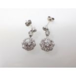 A pair of Diamond Ear Pendants each millegrain-set two old cut stones suspending cluster claw-set