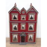 An Art Nouveau Doll's House with unusual triple gable roof, the front opening in two sections to