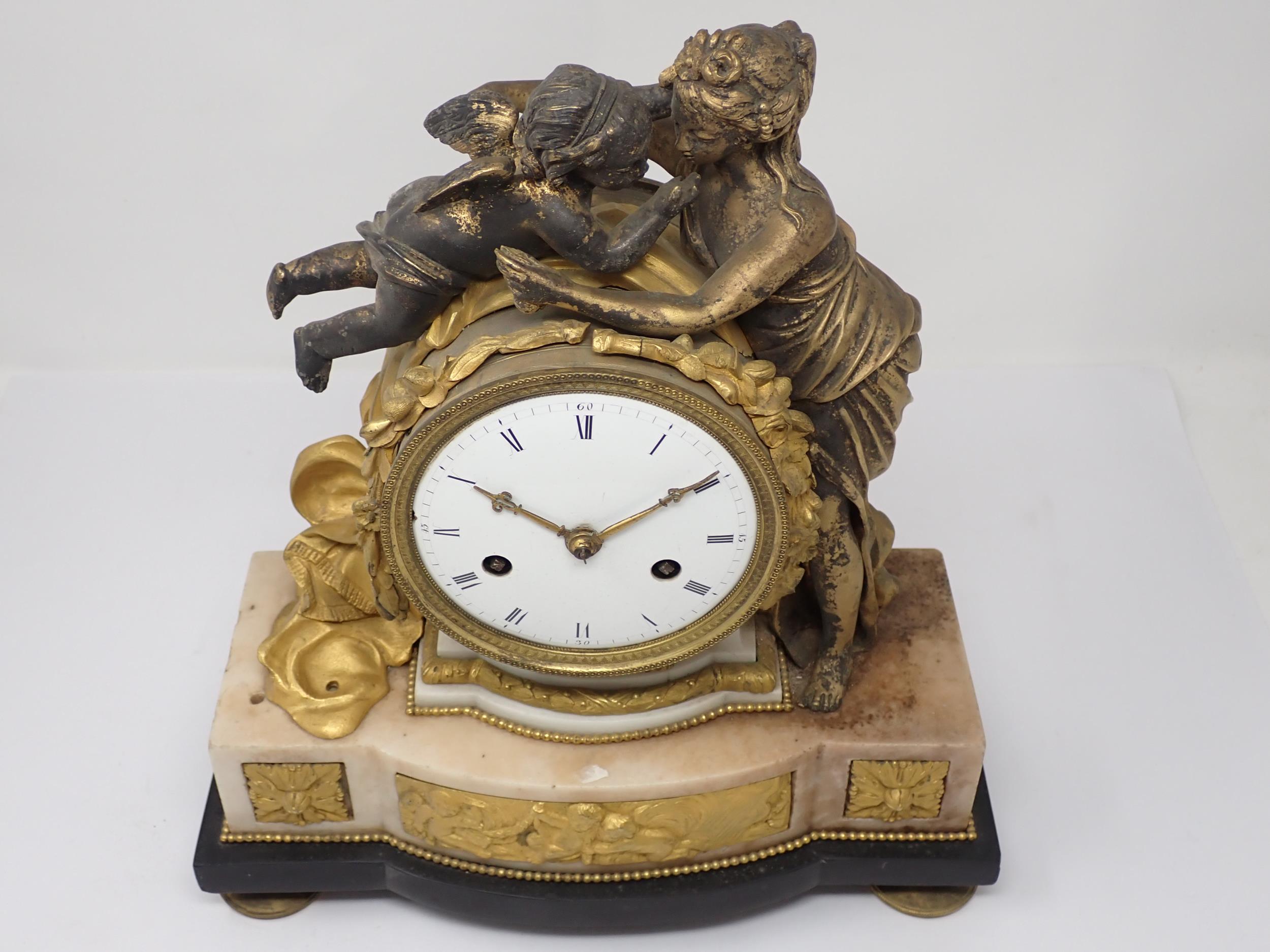 A late 18th Century French gilt metal Mantle Clock flanked and surmounted by classical maiden and - Image 2 of 5