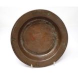 An Orthodox copper Offertory Dish bearing characters to top and underside of rim, 8in diameter
