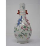 A Chinese famille rose bottle Vase painted fruit and flowers with applied pair of pink and blue