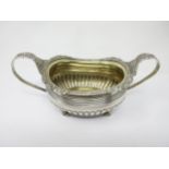 A George III silver two-handled Sucrier with gadroon and shell border, semi-fluted on ball feet,