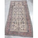 A Belouch Prayer Rug with stylised tree of life design in brown and beige, multi-bordered 6ft x