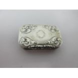 A Victorian silver Vinaigrette of oblong form with chamfered corners, leafage scroll engraved, the