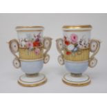 A pair of 19th Century Vases with moulded scroll handles painted flowers in a basket, pale blue to