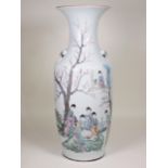 A famille rose baluster Vase with head and ring moulded handles, decorated with figures in a