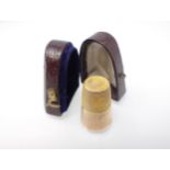 A gold Thimble in leather case, unmarked, approx 3.10gms