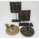 A pair of French bronze Plaques on stands embossed classical figures a late 18th Century French