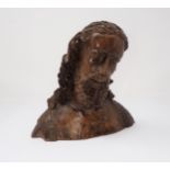 A finely carved wooden Bust, possibly of John the Baptist, with fleece over right shoulder, possibly