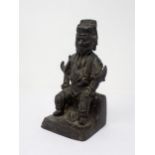 A bronze of a seated Chinese warrior, 8in H