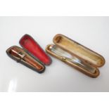 An early 20th Century banded agate Cheroot Holder with 15ct gold mount in original case and a
