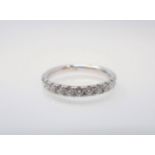 A Diamond half Eternity Ring pavé-set brilliant-cut stones in 18ct white gold, ring size K