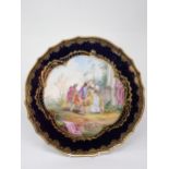 A Dresden Plate, the central panel painted Watteau style scene with gentleman courting a lady in