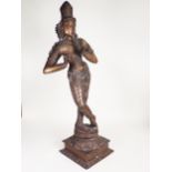 A large bronze Eastern Figure, possibly Krishna, on a square base, 2ft 7in H