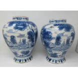 A near pair of 18th Century Delft blue and white Jars painted with panels of hare coursing and a