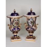 A pair of Spode urn shaped two-handled Vases, decorated panels of landscapes with figures, sailing