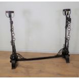 An antique wrought iron central Fire Hearth Crane in the 16th Century style with pair of upright