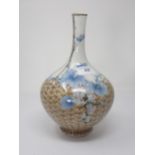 A Meiji Period Japanese Vase by Makuzu Kozan with fruiting vine and wicker fence design and