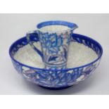 A Charlotte Rhead large Bowl and matching tapering Jug, decorated stylised flowers in blue and