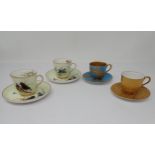 Two Royal Worcester Coffee Cups and Saucers painted starlings, owl on branches and others in flight,