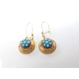 A pair of Turquoise drop Earrings each set cluster of round stones in beaded frame on wire fittings,