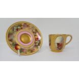 A Royal Worcester miniature Coffee Cup and associated Saucer decorated painted panels, fruit,