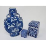 A 19th Century Chinese Moon Flask Vase decorated prunus flowers in blue and white, 8¾in H, small rim