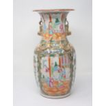 A 19th Century Cantonese baluster Vase with Dog of Fo handles and relief moulded dragons above