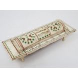 A carved bone Cribbage Board with pierced domed cover containing dominoes and dice, possibly