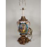 A large porcelain and gilt metal two-handled Table Lamp decorated oval panels with lovers in a