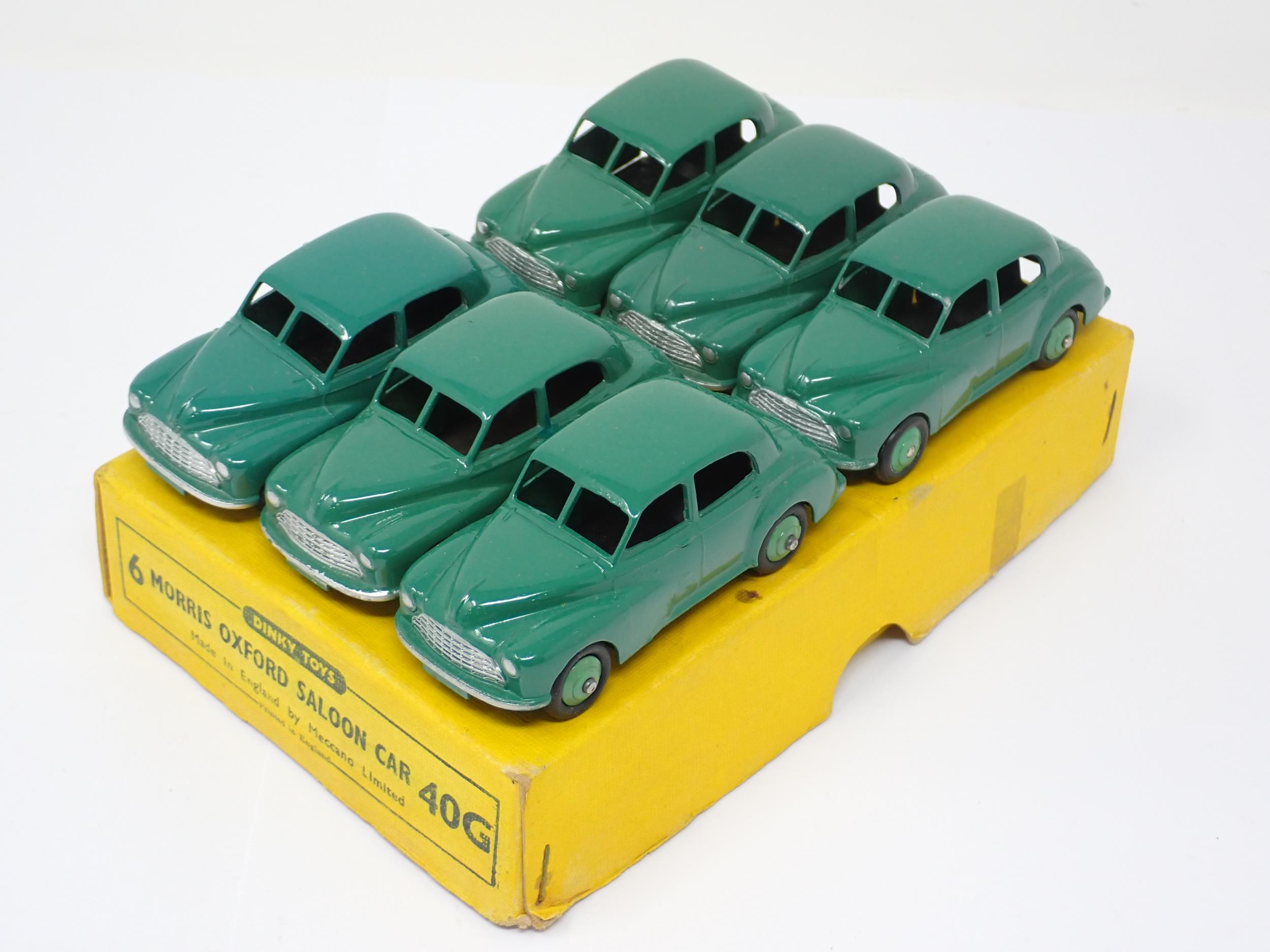 A Dinky Toys No.40G full Trade Box containing six green Morris Oxford Saloon Cars