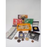 A collection of Coins and Medallions to include Nelson Victory copper badge and medal, a selection