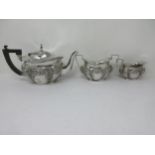 An Edward VII silver three-piece Tea Service, floral and scroll embossed, Chester 1901, 480gms