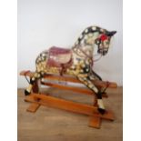 An antique dapple grey Rocking Horse in the manner of Collinson on stained pine base, restored by