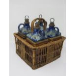 A set of four Doulton Lambeth stoneware Spirit Flasks and Stoppers of square section, G for Gin, B f
