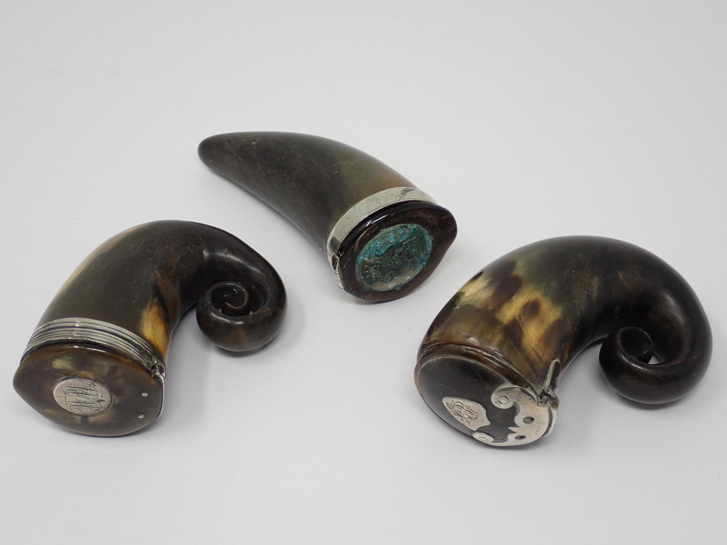 Three 19th Century horn Snuff Mulls with white metal mounts, shield shaped, circular shaped and one