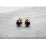 A Pair of Sapphire Earrings each claw-set heart shaped cabochon in 18ct gold