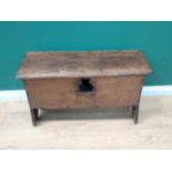 A 17th Century oak plank Coffer with hinged top, moulded detail on shaped side supports, 3ft 1in (la