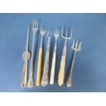 Six various silver Pickle and Bread Forks and a silver Lobster Pick