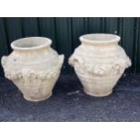 A pair of jesmonite composite two-handled Urns, moulded from originals on the Plymouth Estate, Ludlo