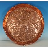 An Arts and Crafts copper Tray in the manner of Newlyn, with embossed fish design and shaped rim, 16
