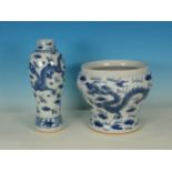 A Chinese blue and white Jardiniere with dragon design, 7¼in H, and a Chinese blue and white slender