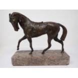 A bronze figure of a Horse with saddle on marble base, 9in L