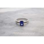 A Sapphire and Diamond Ring corner claw-set step-cut sapphire, 1.53cts, with brilliant-cut diamonds