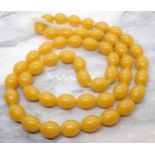 An amber type bead Necklace, approx 97gms