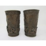 A pair of bronzed Beakers of tapering form relief decorated merrymaking figures in village scene, 5¼