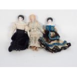 Three small ceramic headed Dolls each in costume, 6 1/4 in approx.